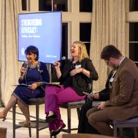 President Mantella on stage with three panelists